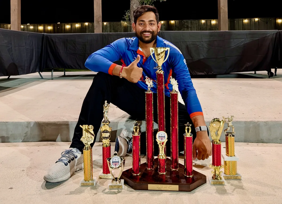 Eklavya captain Sohil Patel seated with the team’s trophies at the LPCL awards ceremony.